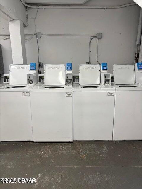 shared laundry area featuring washing machine and clothes dryer