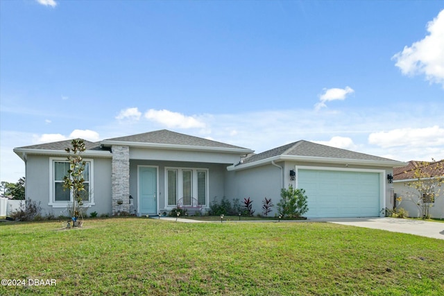 view of front of home featuring a front yard and a garage