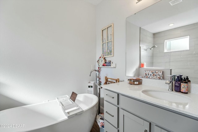 bathroom featuring shower with separate bathtub and vanity