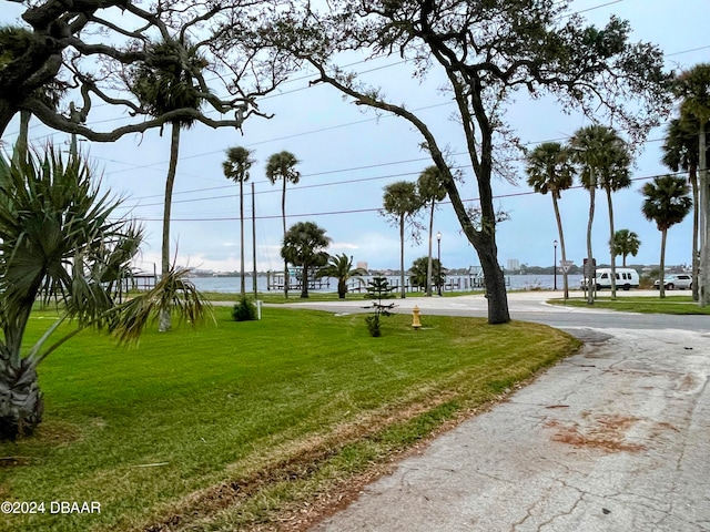 view of home's community featuring a lawn