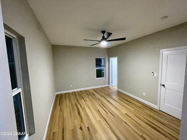 unfurnished room featuring ceiling fan and light wood-type flooring