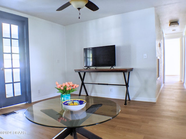 interior space with hardwood / wood-style flooring and ceiling fan