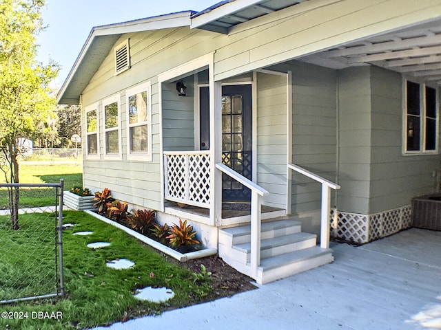 doorway to property with a yard