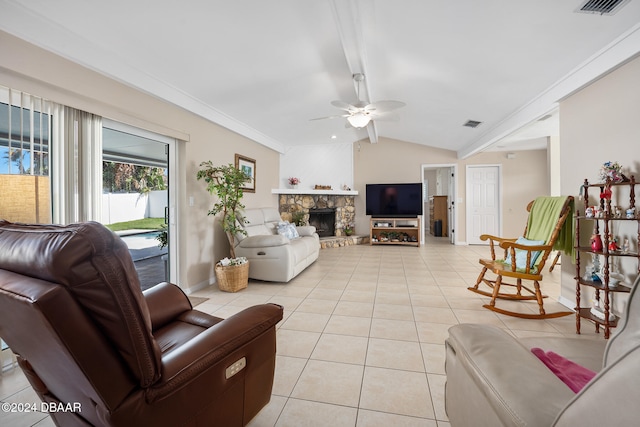 tiled living room with a fireplace, ceiling fan, vaulted ceiling, and ornamental molding