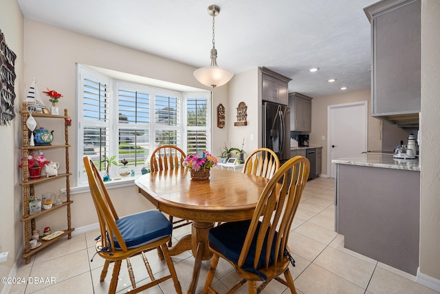 dining space featuring light tile patterned floors