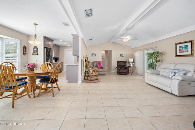 tiled dining space with lofted ceiling with beams and ceiling fan