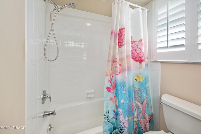 bathroom with toilet and shower / bath combination with curtain