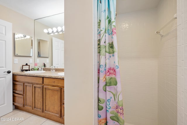 bathroom with vanity, a shower with shower curtain, and tile patterned flooring