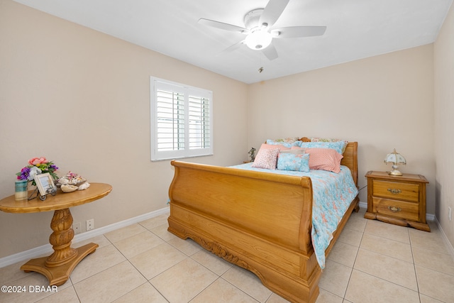 tiled bedroom featuring ceiling fan