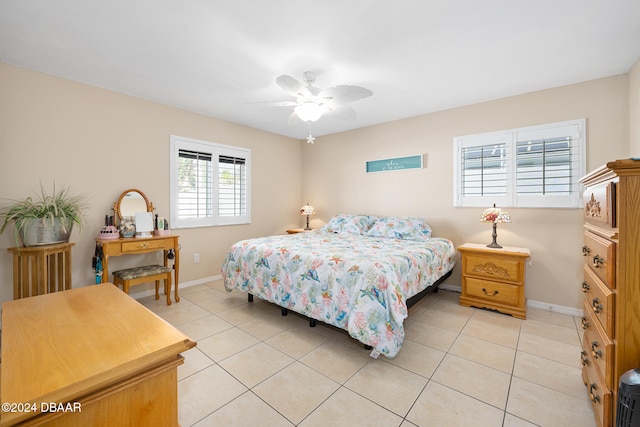 tiled bedroom with ceiling fan