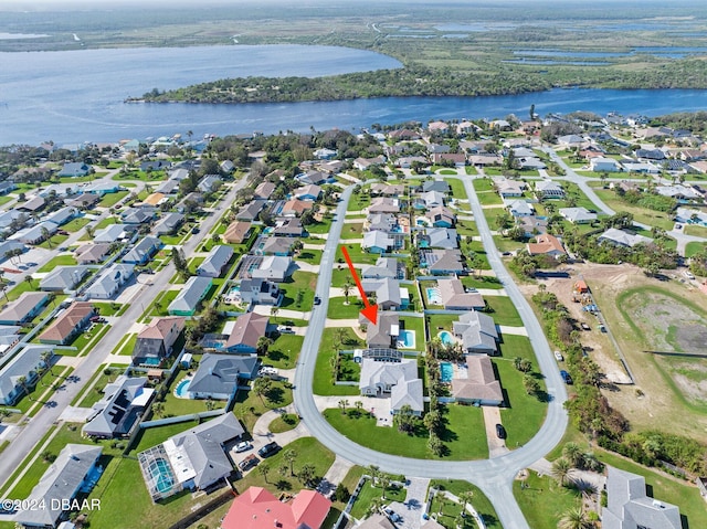 drone / aerial view with a water view