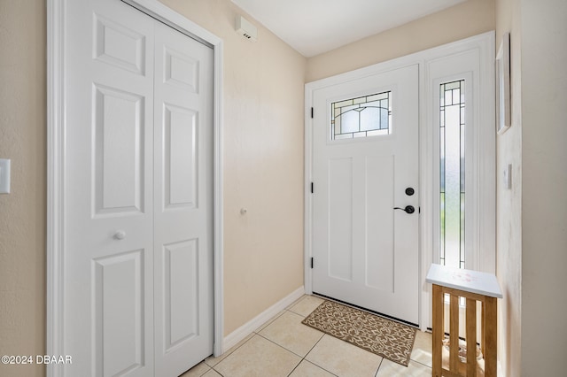 foyer entrance featuring light tile patterned floors