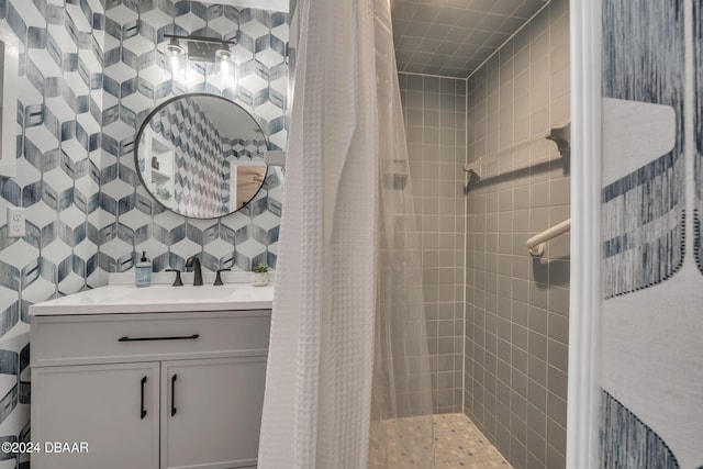 bathroom featuring vanity and curtained shower