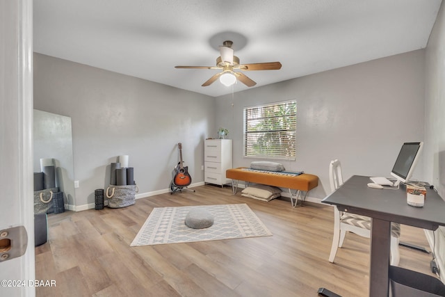 office area with ceiling fan and light hardwood / wood-style flooring