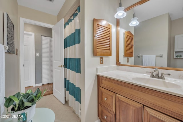 bathroom with tile patterned floors and vanity