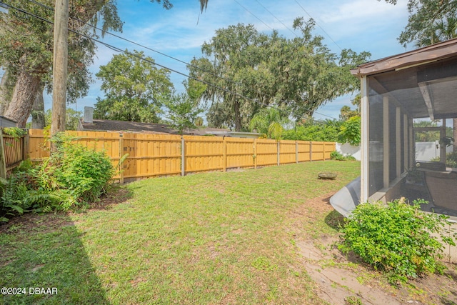 view of yard with a sunroom