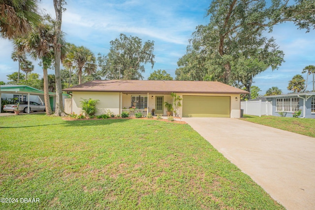 single story home with a porch, a garage, and a front lawn