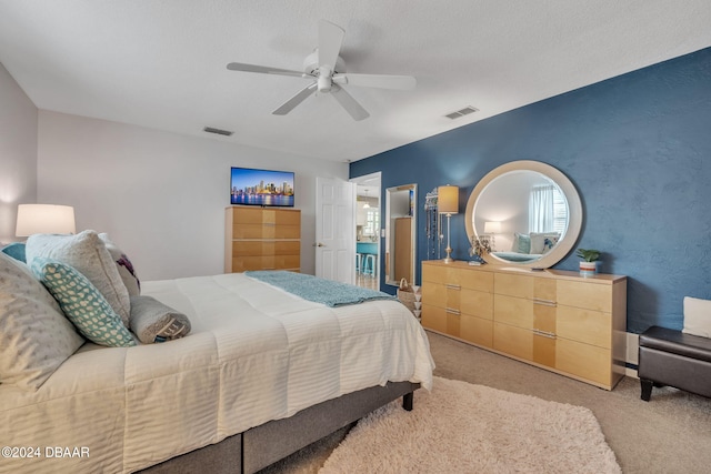 carpeted bedroom with ceiling fan