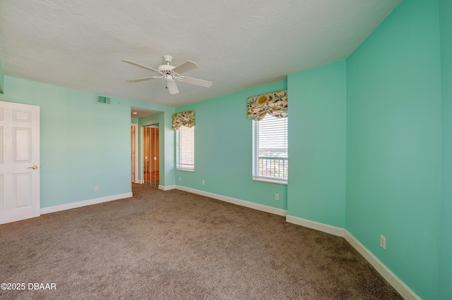 unfurnished bedroom with ceiling fan and carpet floors