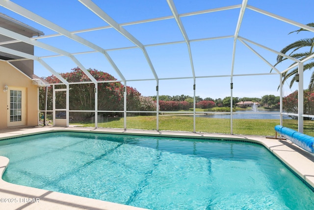 outdoor pool with a water view, a lanai, and a patio area