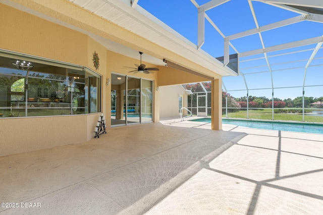 outdoor pool with a lanai, a patio area, and ceiling fan