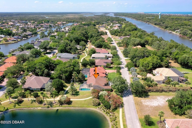 bird's eye view with a residential view and a water view