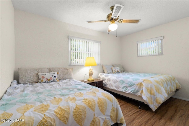 bedroom featuring ceiling fan and wood finished floors