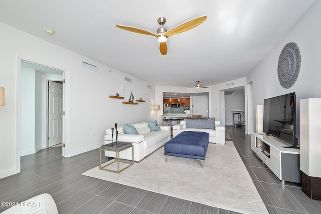 231 Riverside Dr Unit 1903-1, Daytona Beach, FL 32117 - living room with ceiling fan and baseboards