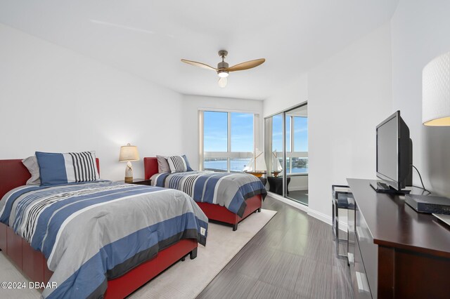 231 Riverside Dr Unit 1903-1, Daytona Beach, FL 32117 - bedroom with baseboards and a ceiling fan