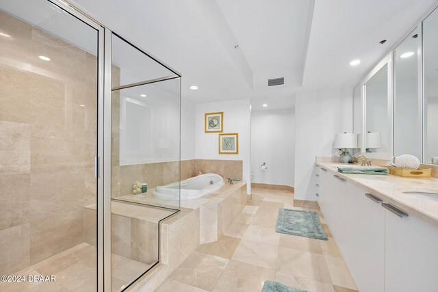 231 Riverside Dr Unit 1903-1, Daytona Beach, FL 32117 - full bathroom with a shower stall, a bath, recessed lighting, double vanity, and toilet