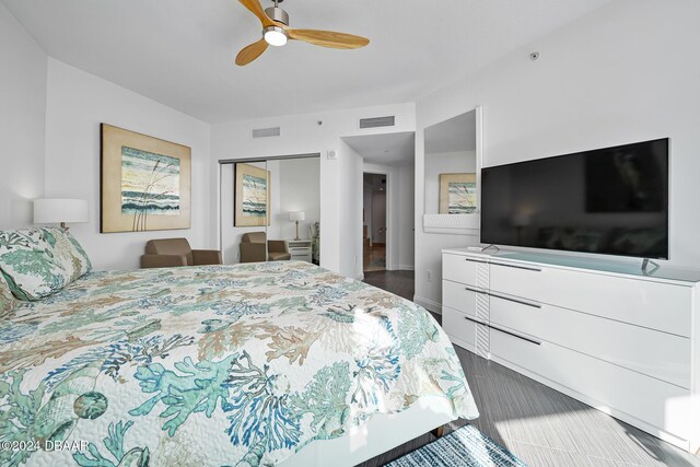 231 Riverside Dr Unit 1903-1, Daytona Beach, FL 32117 - bedroom featuring dark wood-style flooring, a closet, and a ceiling fan