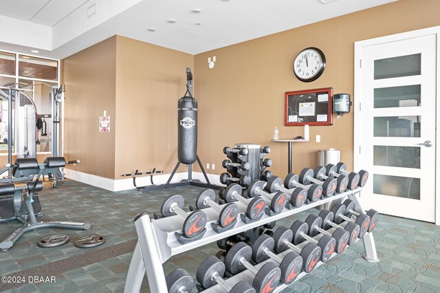 231 Riverside Dr Unit 1903-1, Daytona Beach, FL 32117 - exercise room featuring carpet floors and baseboards