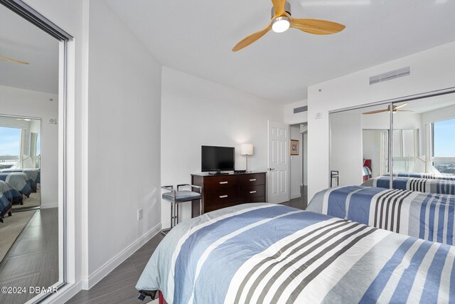 231 Riverside Dr Unit 1903-1, Daytona Beach, FL 32117 - bedroom with a ceiling fan and dark wood-type flooring