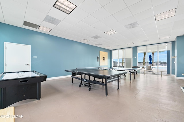 231 Riverside Dr Unit 1903-1, Daytona Beach, FL 32117 - playroom with floor to ceiling windows, baseboards, and finished concrete flooring