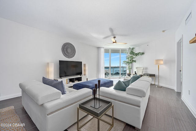 living room with hardwood / wood-style floors and ceiling fan