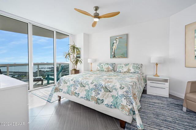 231 Riverside Dr Unit 1903-1, Daytona Beach, FL 32117 - bedroom with a wall of windows, access to exterior, and a ceiling fan