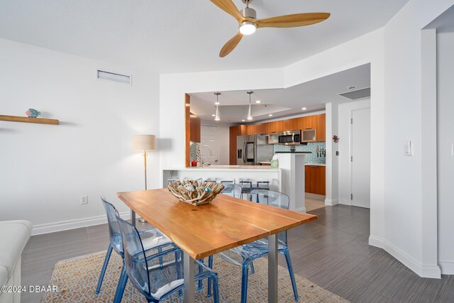 231 Riverside Dr Unit 1903-1, Daytona Beach, FL 32117 - dining area featuring a ceiling fan, baseboards, wood finished floors, and recessed lighting