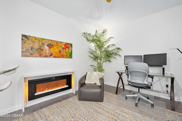 231 Riverside Dr Unit 1903-1, Daytona Beach, FL 32117 - office space featuring a glass covered fireplace, baseboards, and wood finished floors