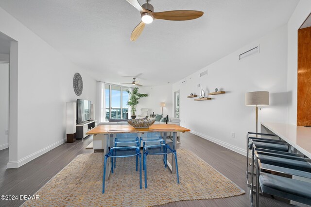 231 Riverside Dr Unit 1903-1, Daytona Beach, FL 32117 - dining area with a ceiling fan, baseboards, and dark wood-style floors