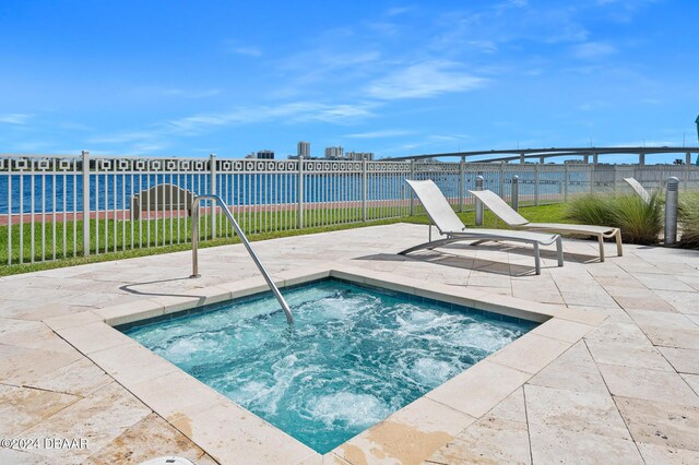 231 Riverside Dr Unit 1903-1, Daytona Beach, FL 32117 - view of pool featuring a patio area, fence, and a community hot tub