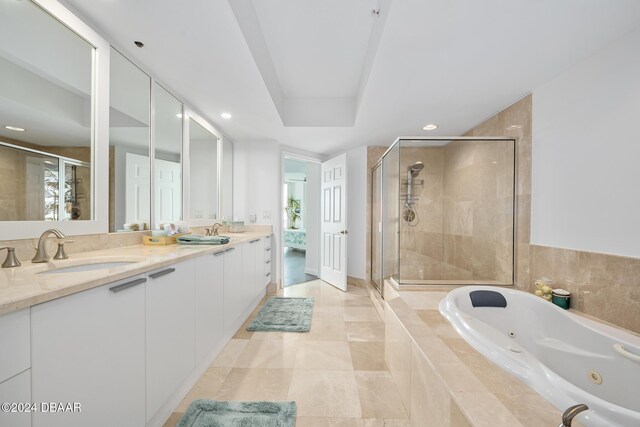 231 Riverside Dr Unit 1903-1, Daytona Beach, FL 32117 - full bathroom featuring a stall shower, a jetted tub, double vanity, recessed lighting, and tile patterned flooring