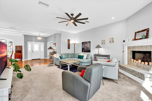 2 Bulows Lndg, Flagler Beach, FL 32136 - carpeted living room featuring ceiling fan, a brick fireplace, and baseboards