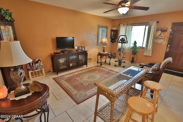 tiled living room with ceiling fan