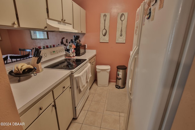 kitchen featuring white cabinetry, white appliances, and light tile patterned floors