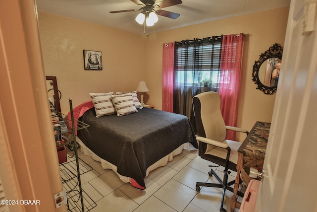 tiled bedroom featuring ceiling fan