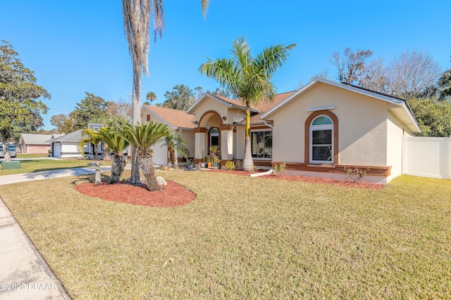 view of front of home with a garage and a front yard