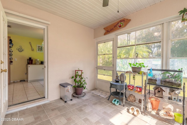 sunroom / solarium featuring plenty of natural light