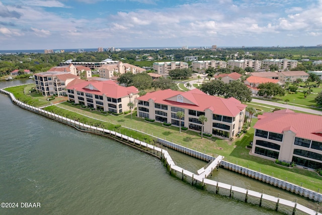 birds eye view of property with a water view