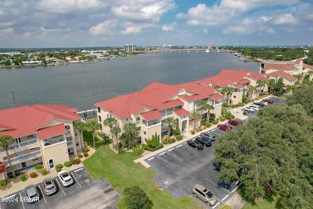 birds eye view of property with a water view