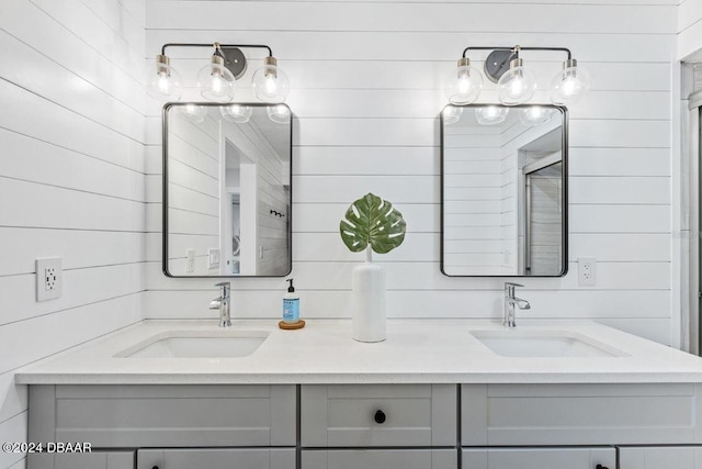 bathroom with wood walls and vanity